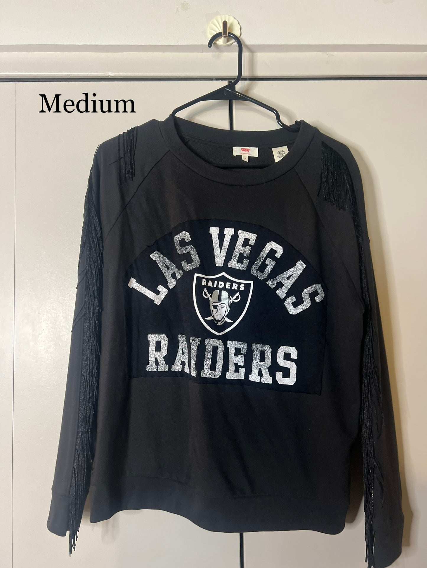 Raiders fringe sweater